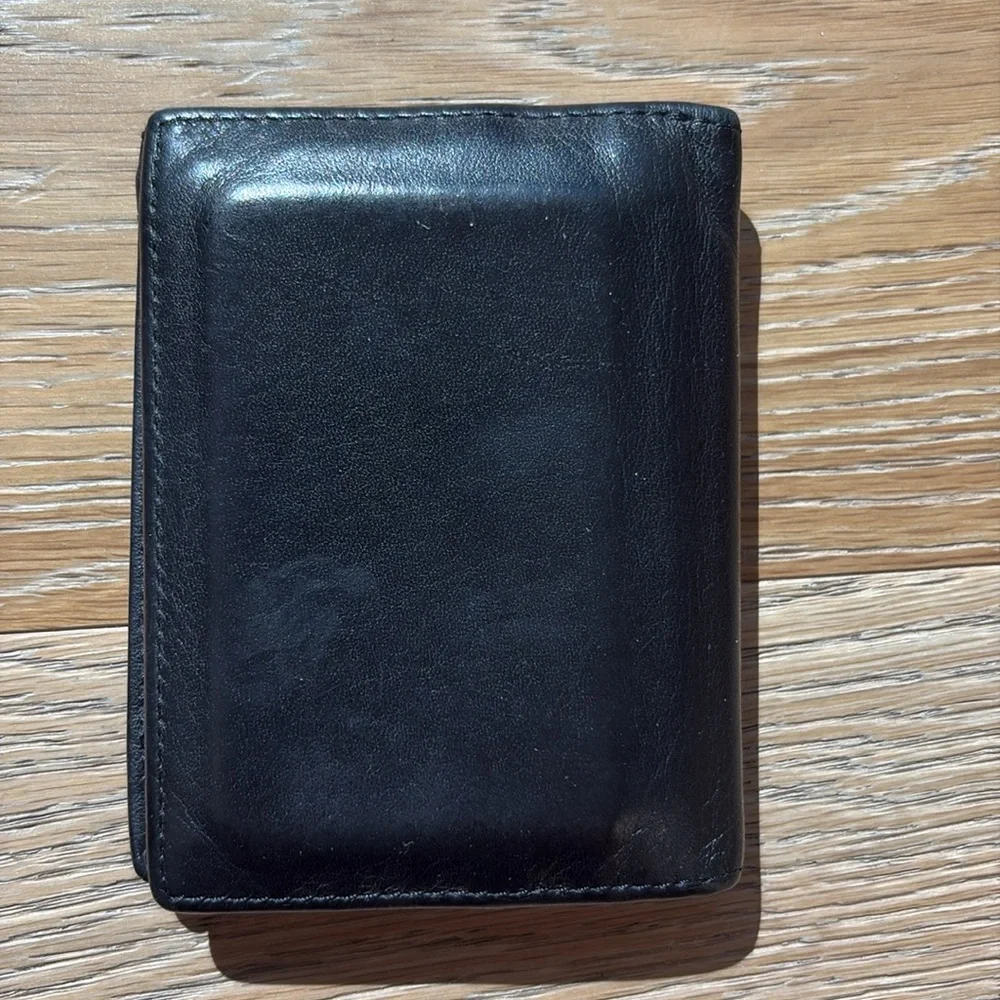 Tumi black men’s wallet with photo ID pocket
